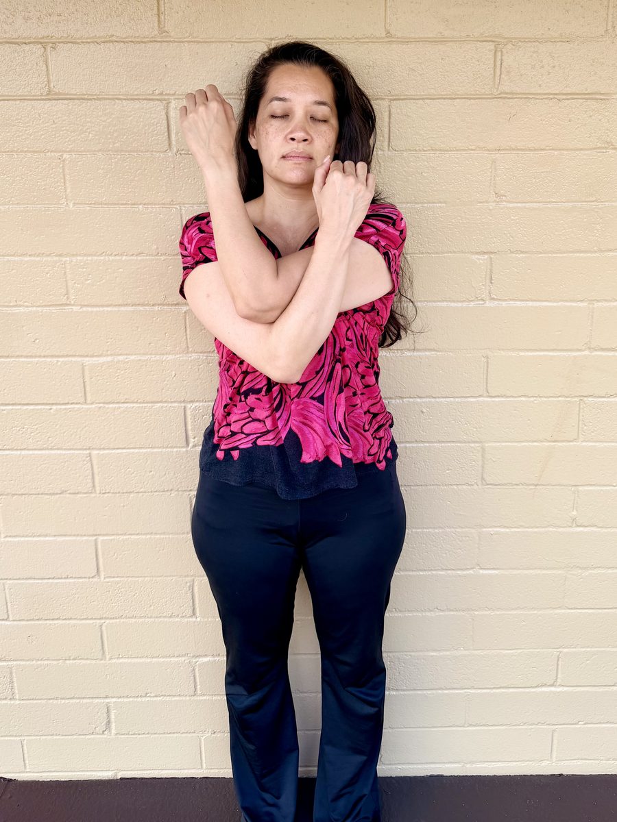 Demonstration of the cross-body shoulder stretch